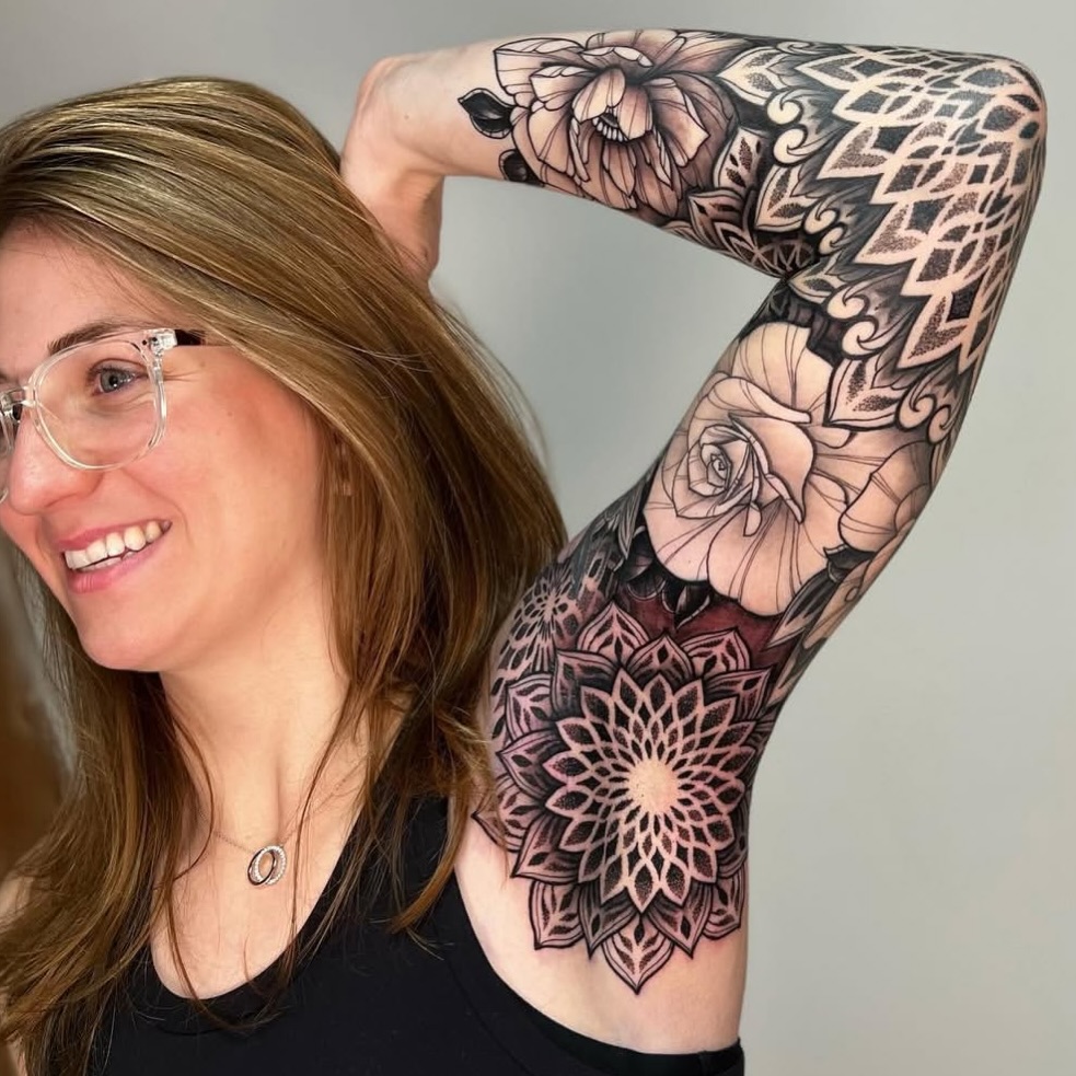 Intricate black-and-gray floral mandala sleeve with geometric patterns