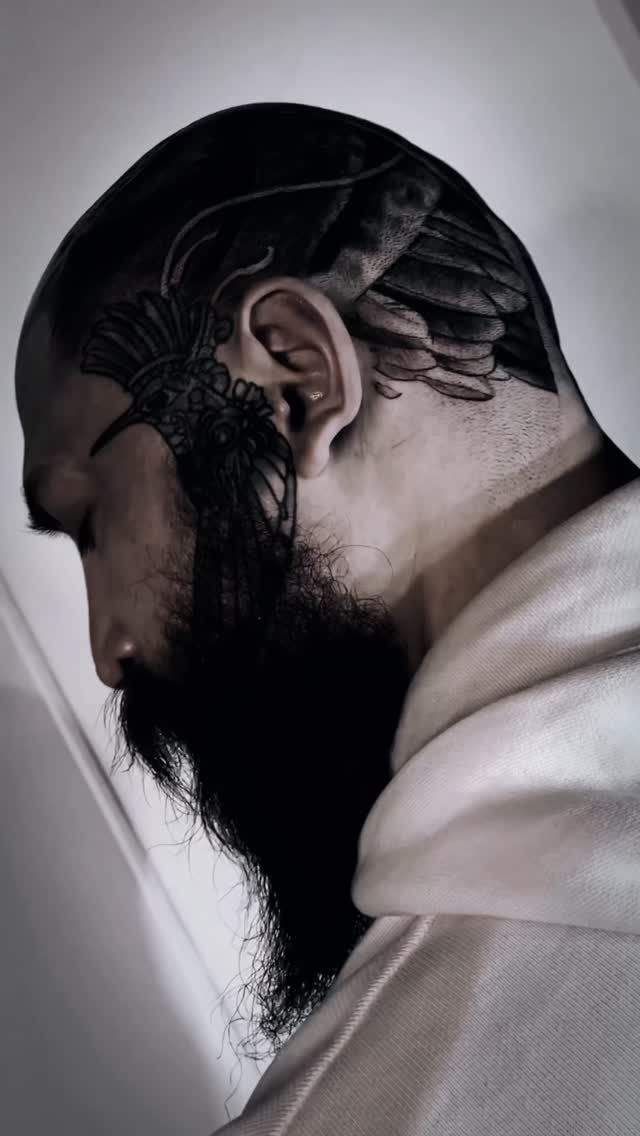 Bold blackwork headpiece with ornate lace filigree.