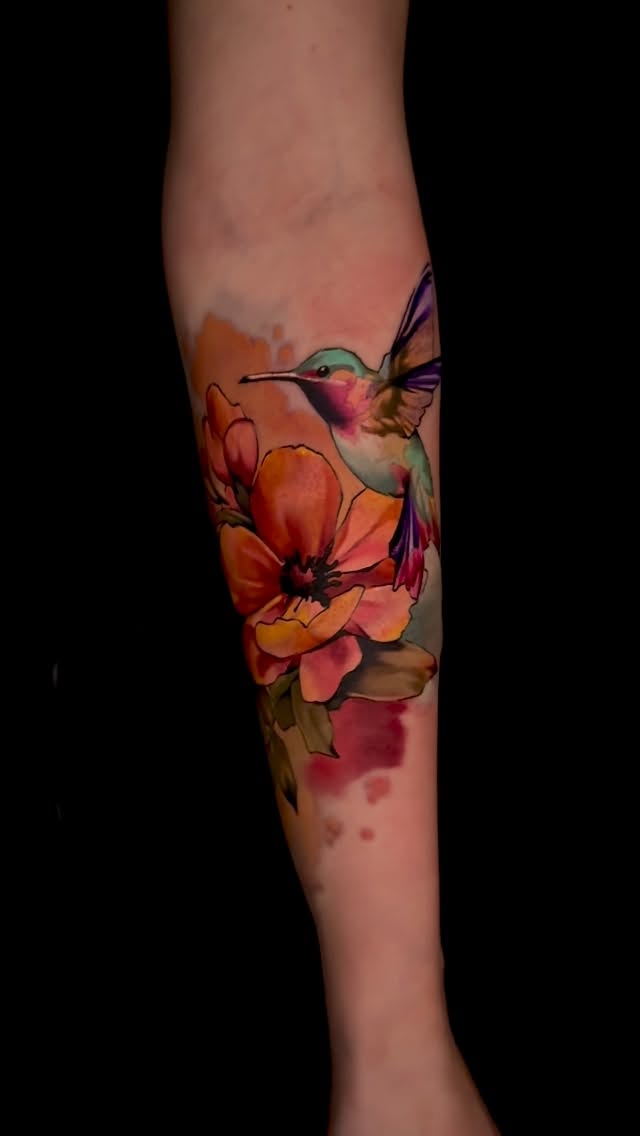 Vibrant watercolor hummingbird weaving through tropical blooms