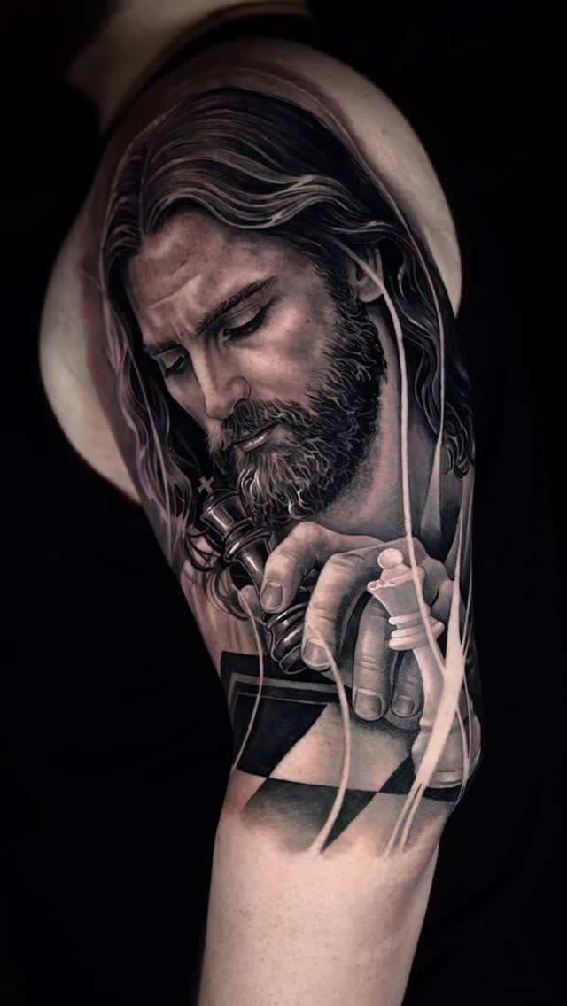 Monochrome contemplative Jesus portrait with chessboard motif