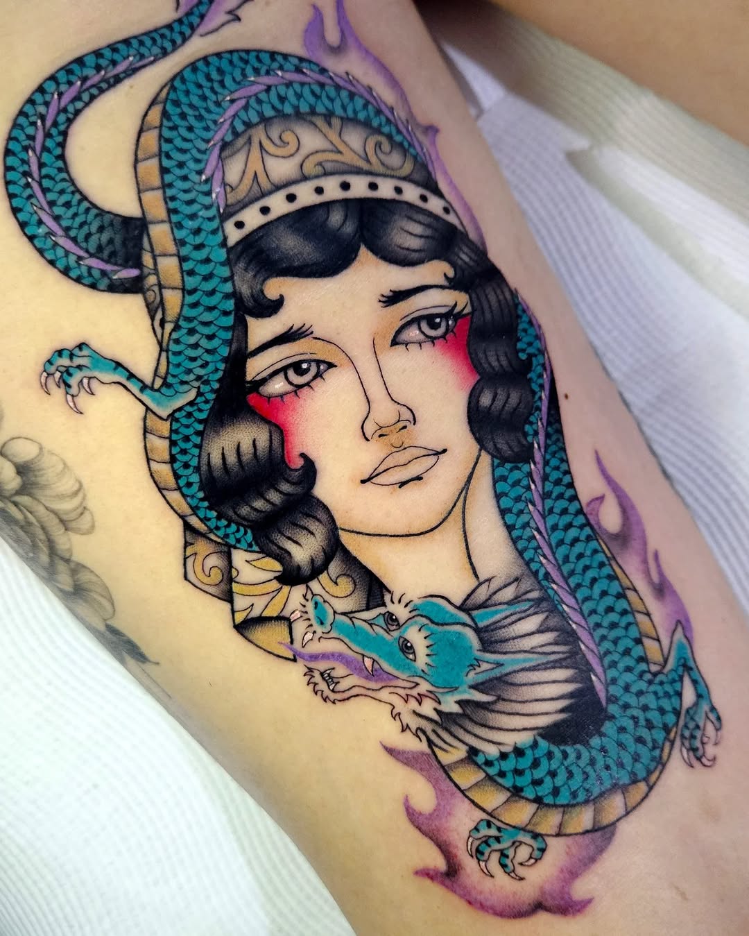 Bold neo-traditional portrait framed by teal dragon