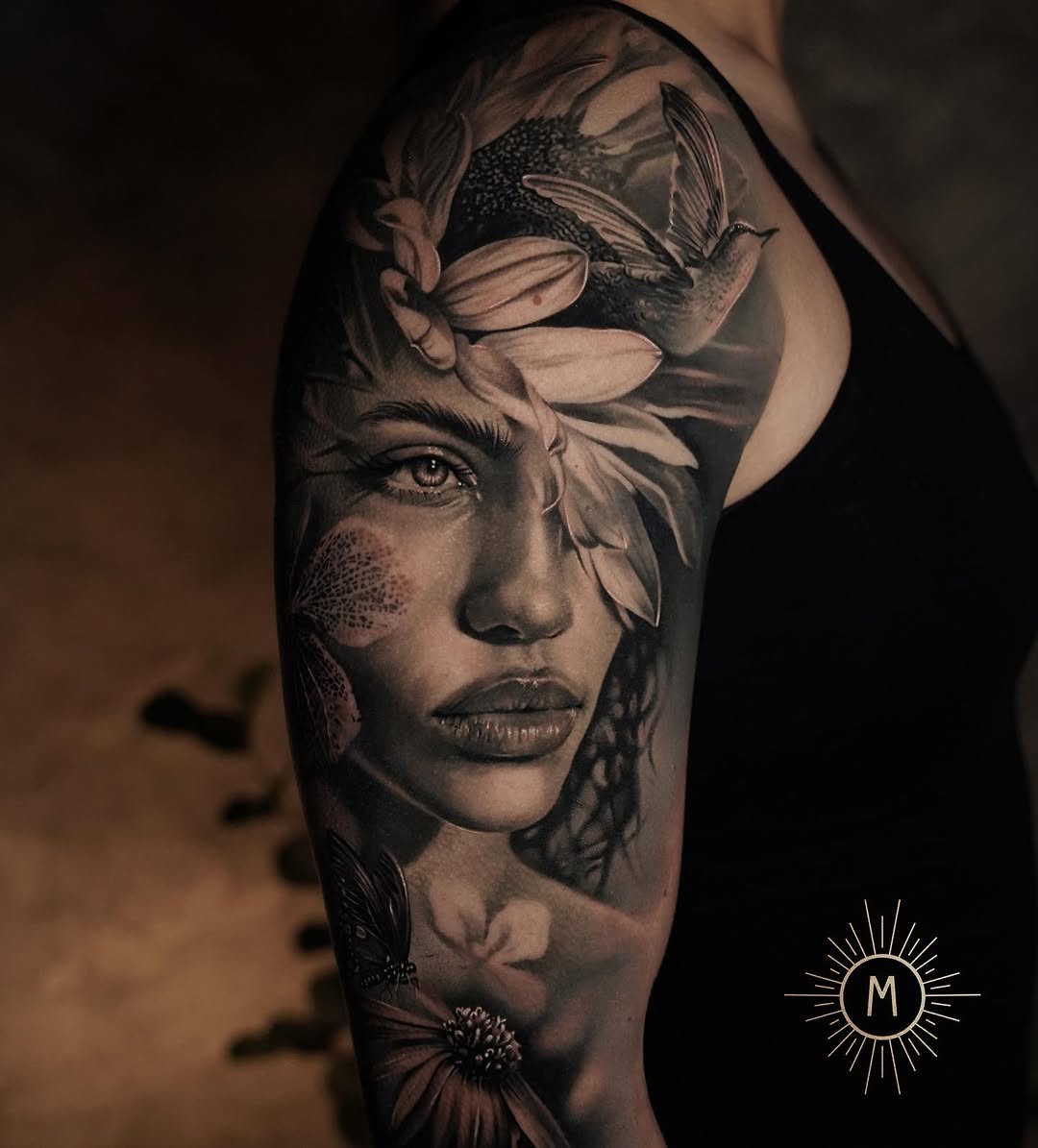 Photorealistic grayscale portrait with blooming flowers on arm