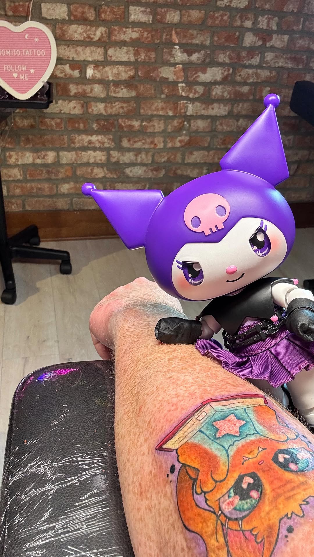 Vibrant kawaii cartoon creature tattoo with bold colors