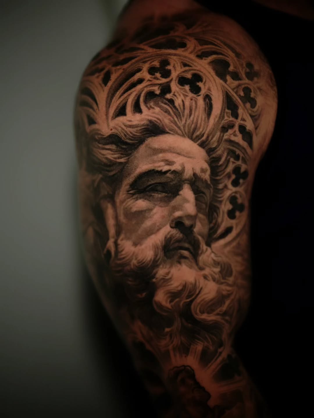 Religious portrait in bold black-and-gray with ornate halo