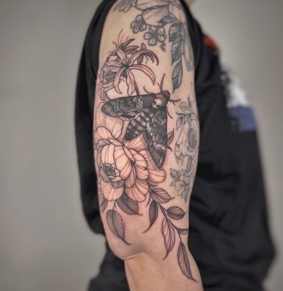 Elegant death moth perched among lush peony blossoms