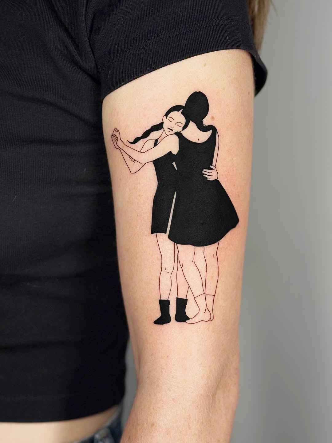 Minimalist dancing duo in bold black silhouette