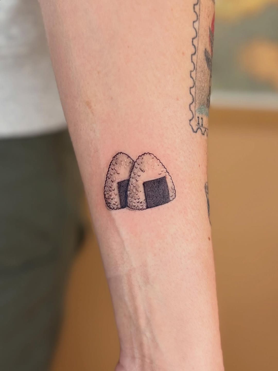 Two small onigiri shapes with dotted rice texture