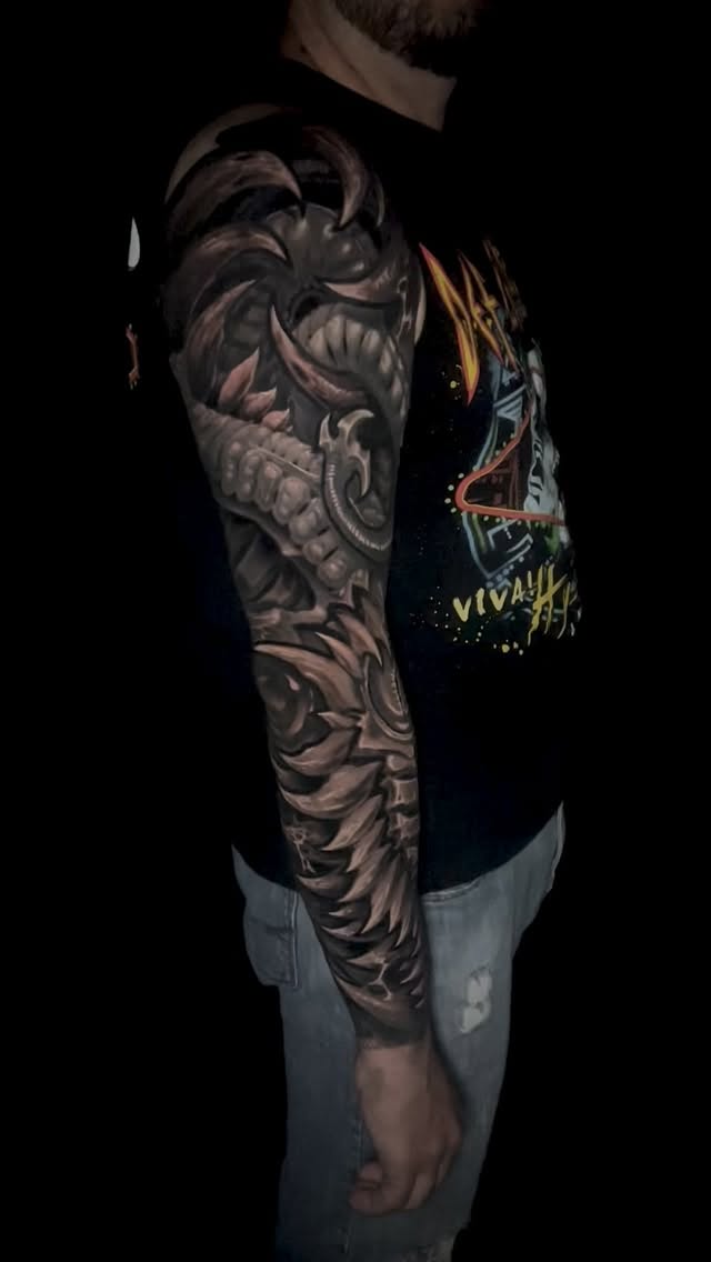 Hyper-detailed black-gray biomechanical sleeve with gears