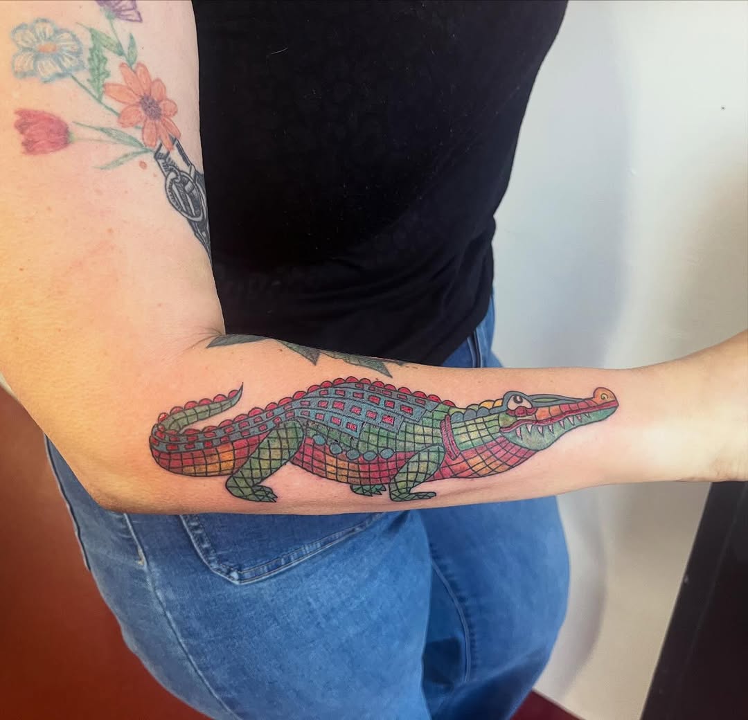 Vibrant rainbow alligator with patchwork scales and bold outlines