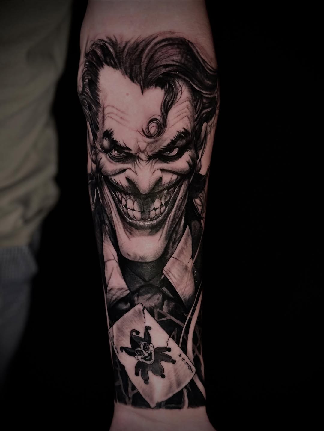 Intense black-and-gray Joker portrait with sharp contrast