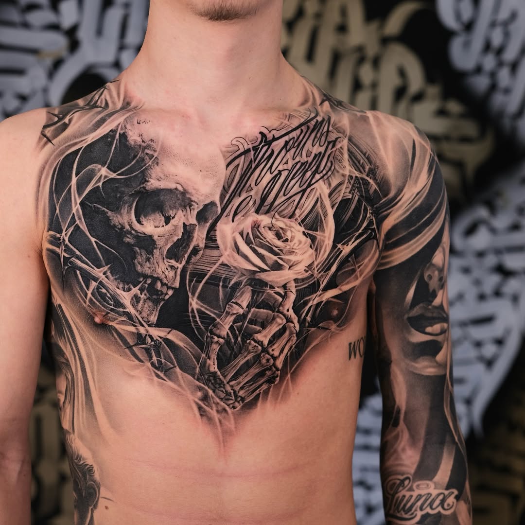 Bold black-and-gray chest piece with skull and rose.