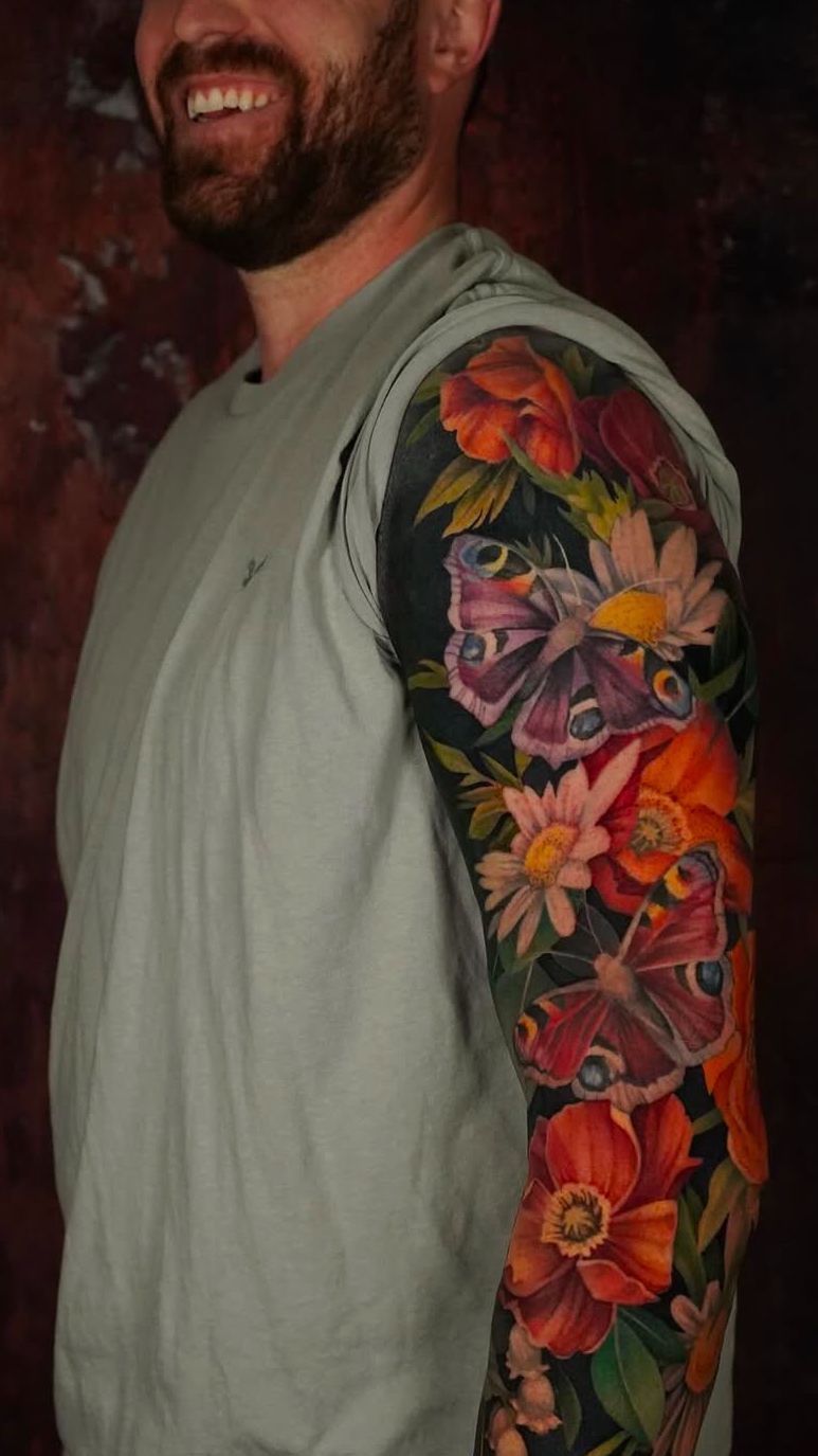 Vibrant botanical sleeve with bold petals and vivid moths