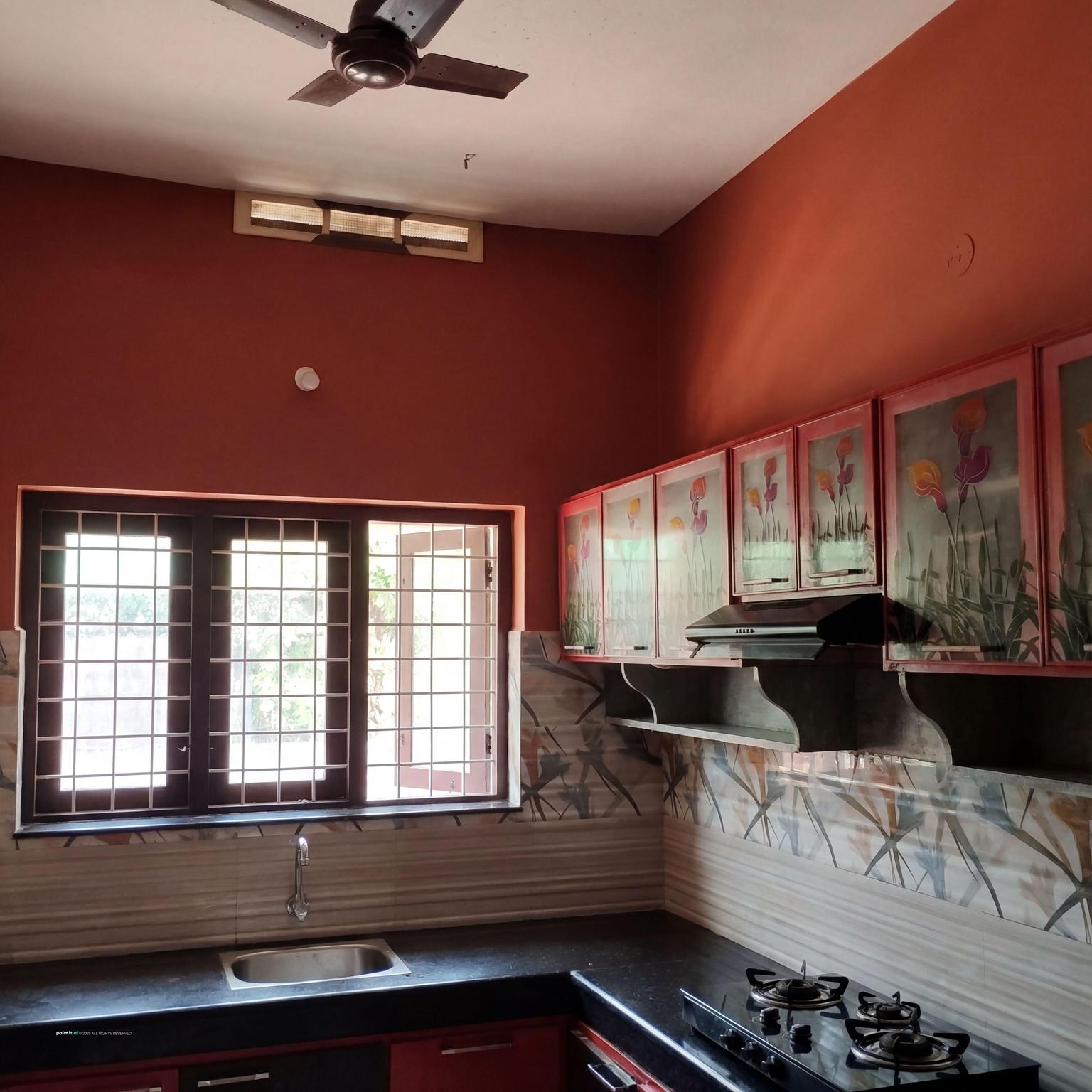 Kitchen with walls painted a Southwest brick red and dark wood cabinets