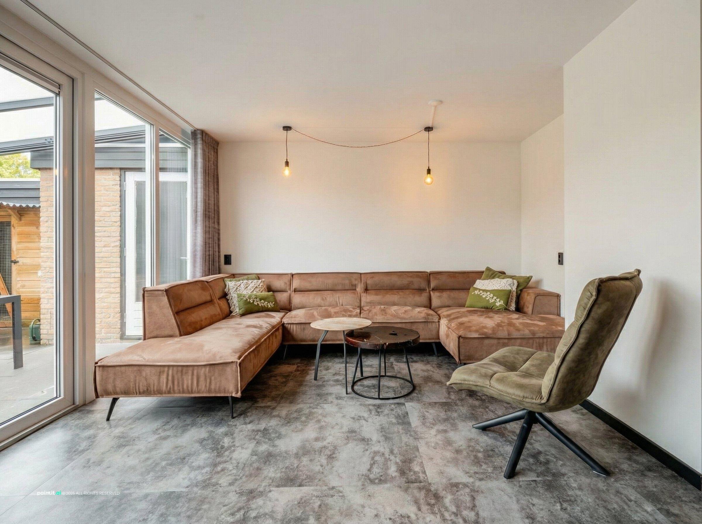 Living room with a tan corner sectional, a swivel chair and a grey rug