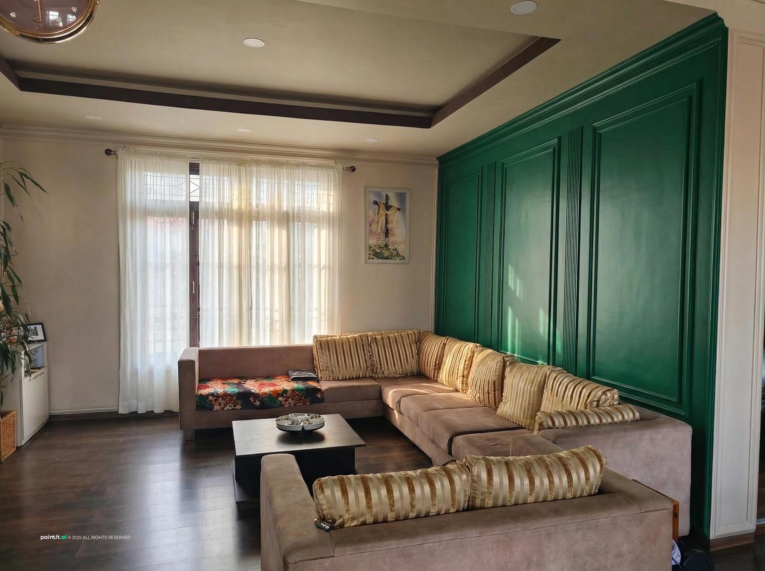 Sitting room with a deep emerald accent wall, a gilded cornice, a neutral sofa and a crystal chandelier