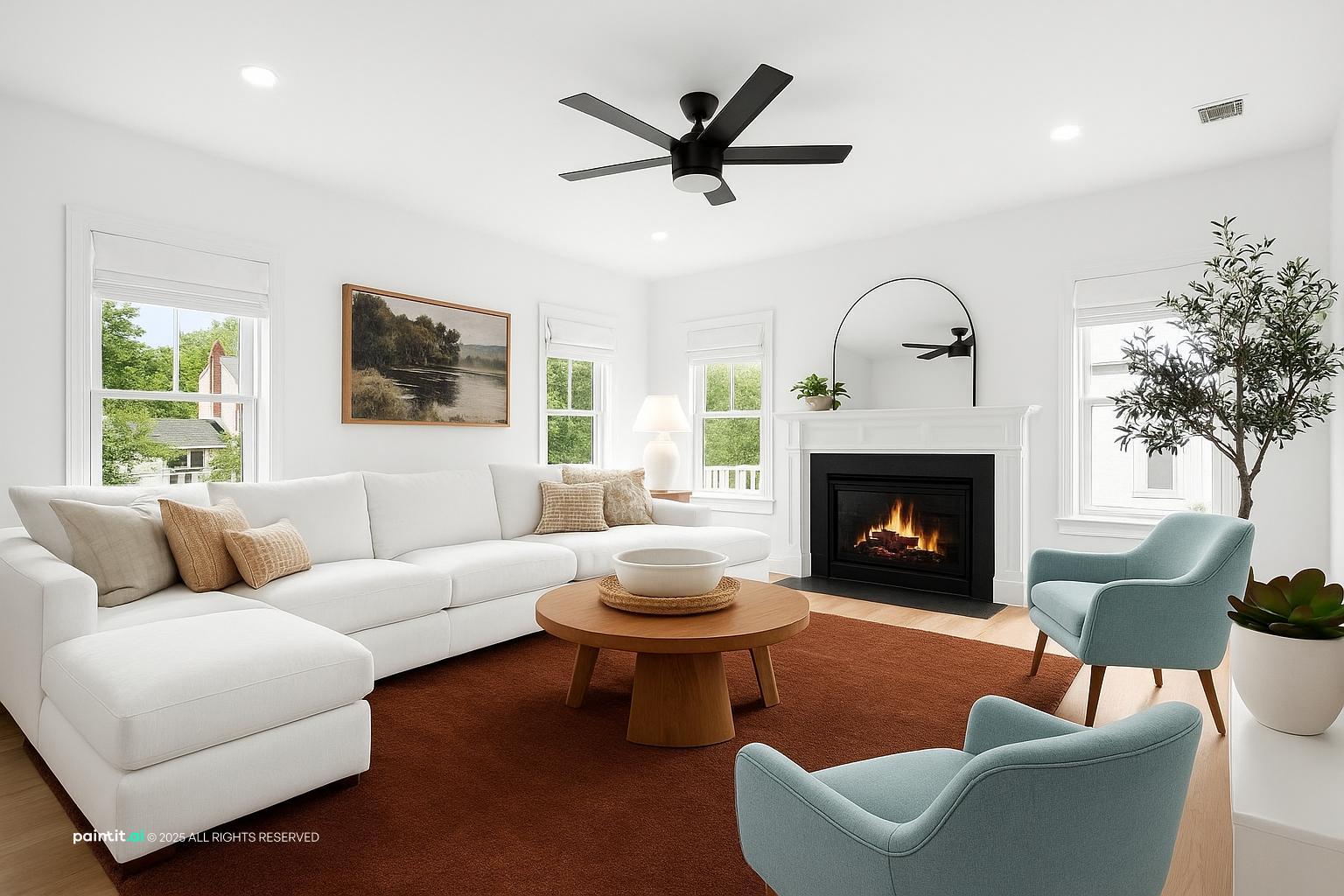 Living room with a white sectional, a brown wooden coffee table, light blue chairs and a white fireplace