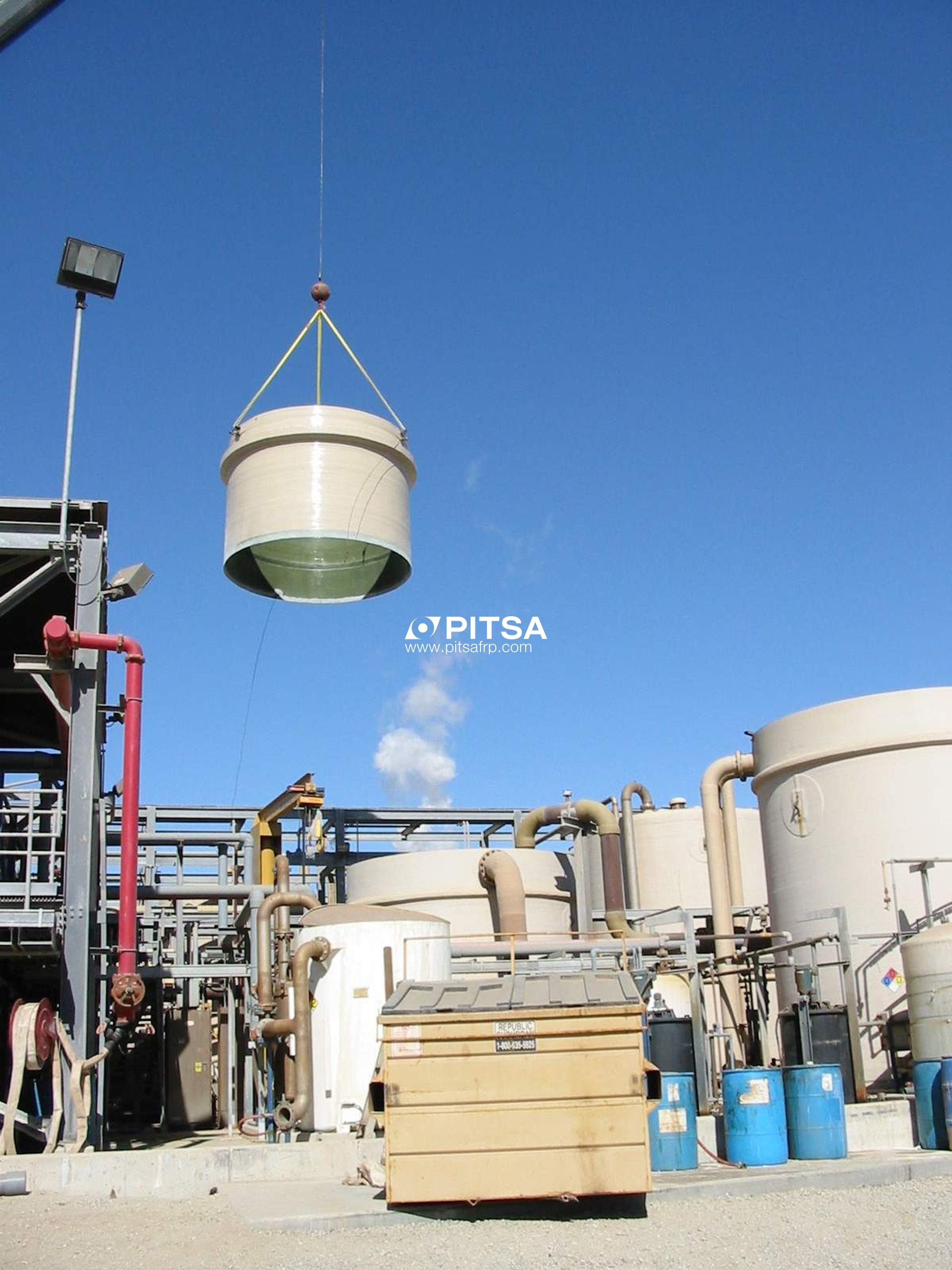PITSA engineers supervising the installation of large diameter plastic FRP tanks using a crane.