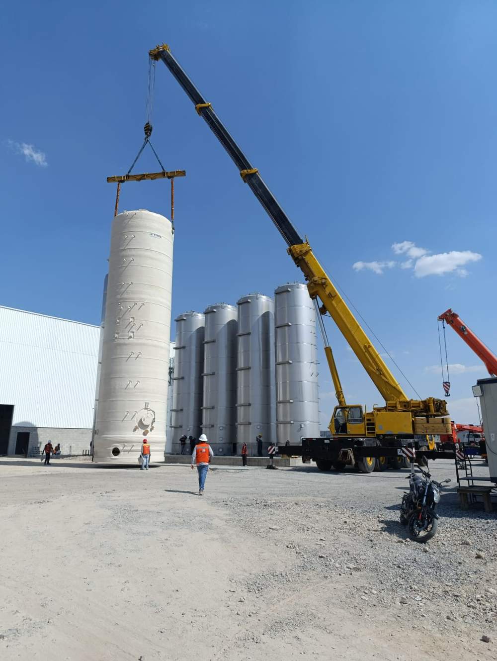 FIberglass tank being lifted by crane