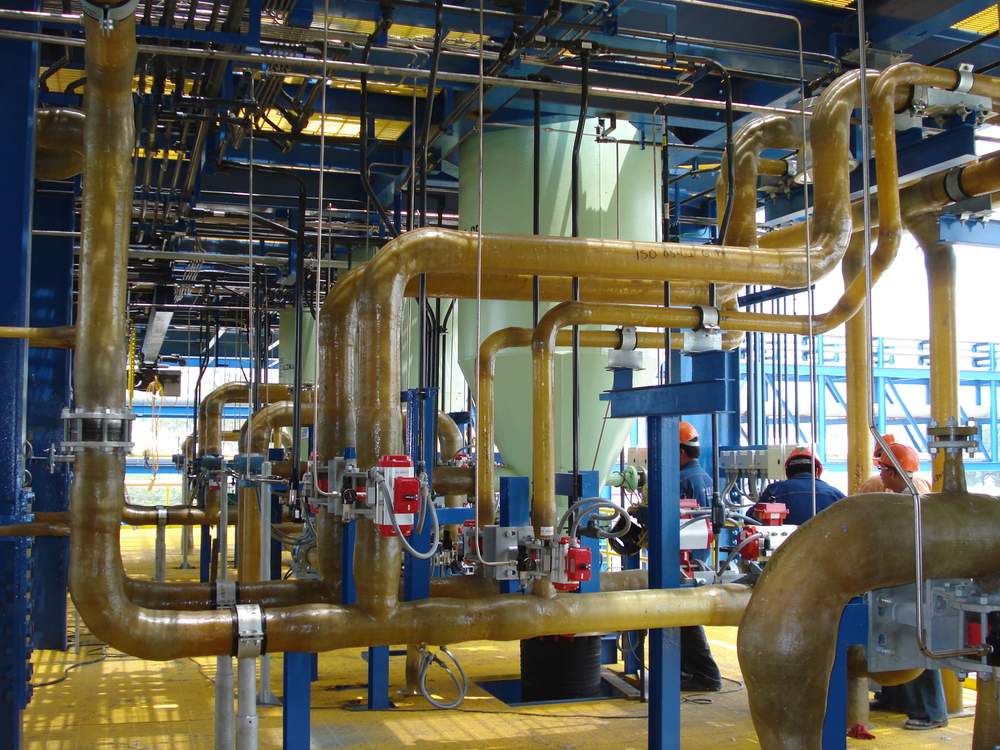 Manufacturing of custom isometric fiberglass piping in an industrial plant.