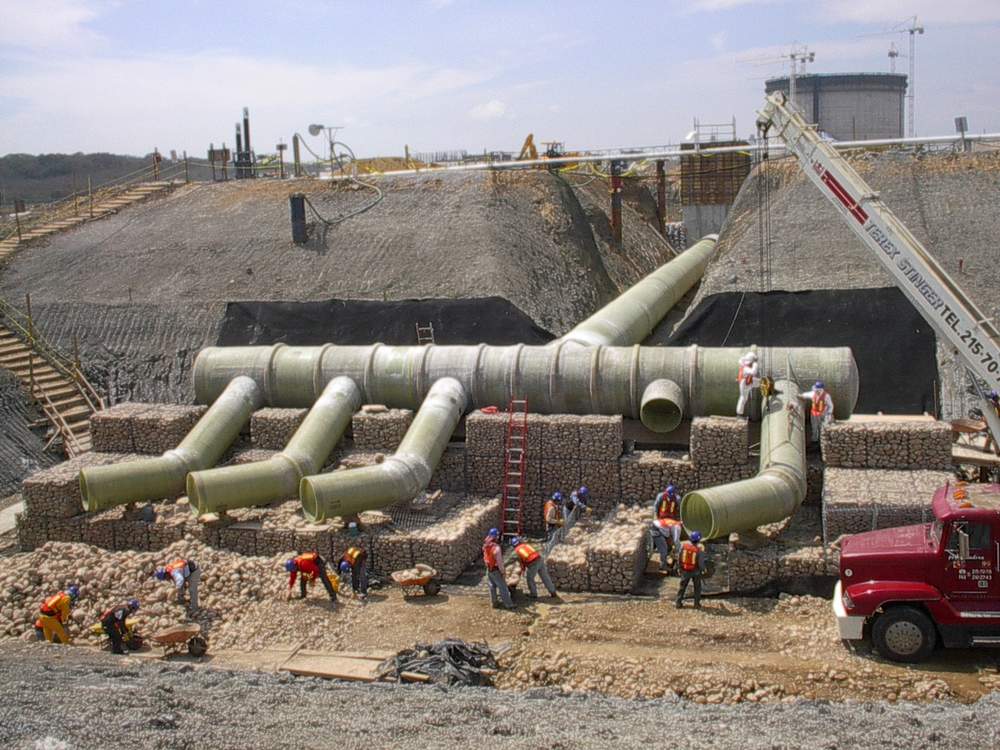 Installation of a large-diameter fiberglass duct system for gas transport.
