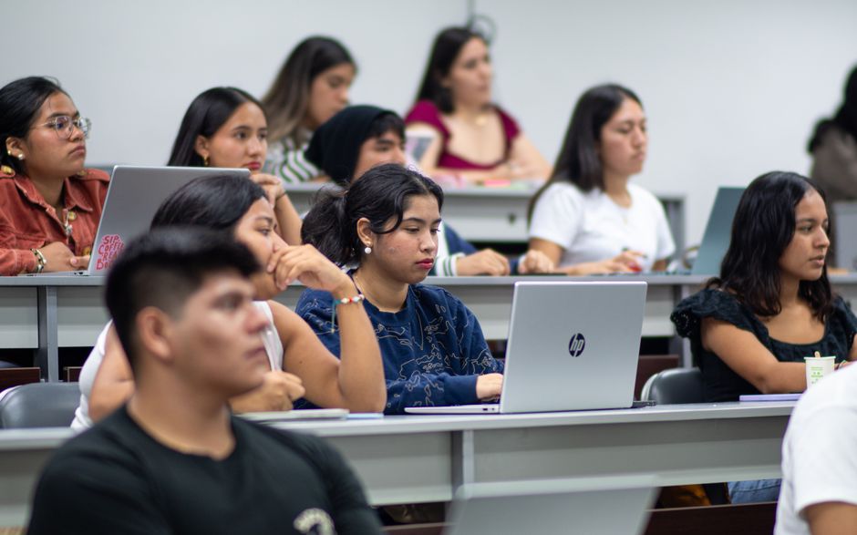 A diverse group of students attentively listening during a lecture