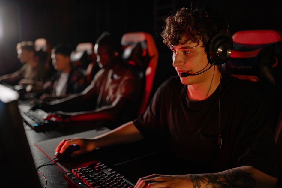 Dedicated team of young gamers engaging in a competitive esports match