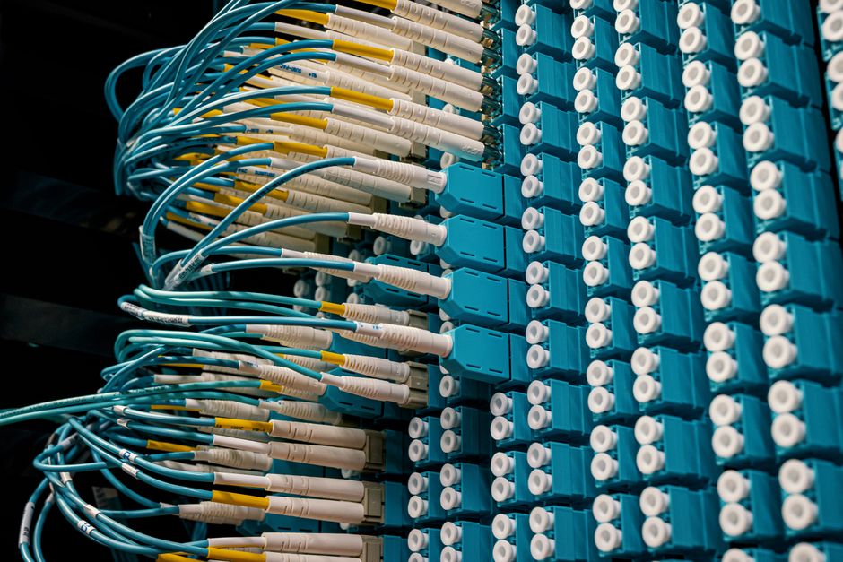 Fiber optic patch cables connecting to a blade