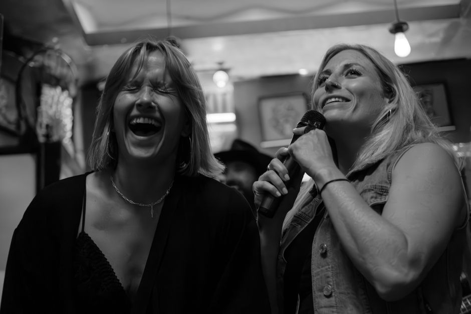 Women singing at karaoke