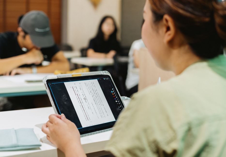 Students using a tablet for digital learning