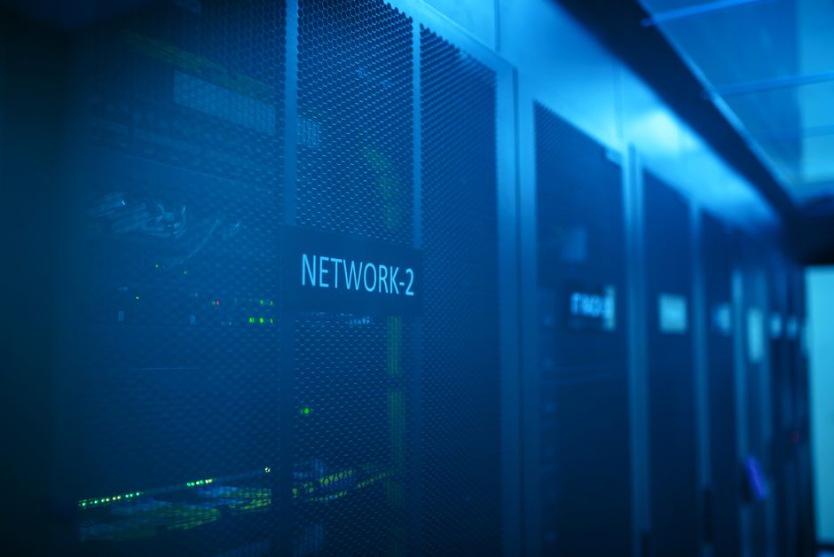 Modern server room with blue lighting and network equipment