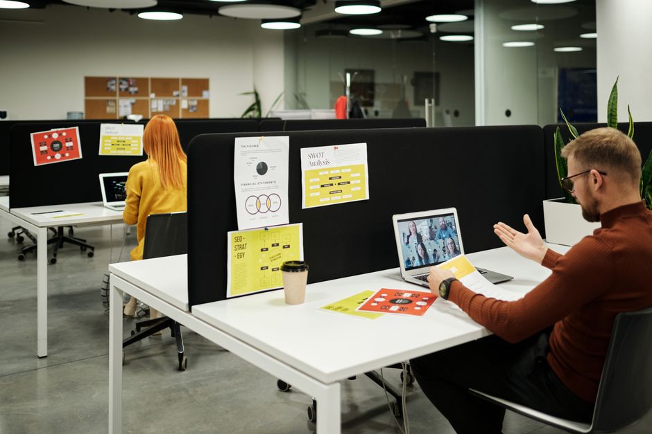 Colleagues working virtually at a stylish workspace