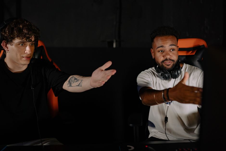Two men intensely gaming, showcasing teamwork and strategy