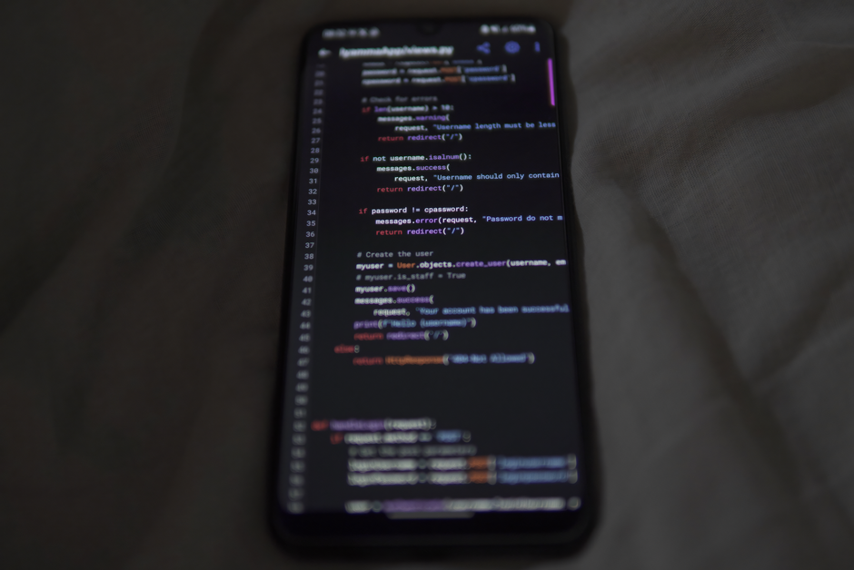 Close-up of a smartphone showing Python code on the display