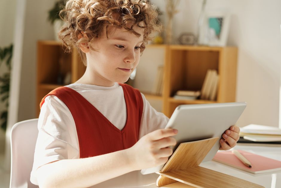 Young child using tablet for learning