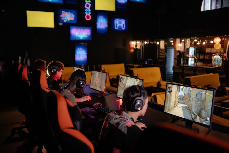 Group of gamers participating in an online tournament at a modern venue