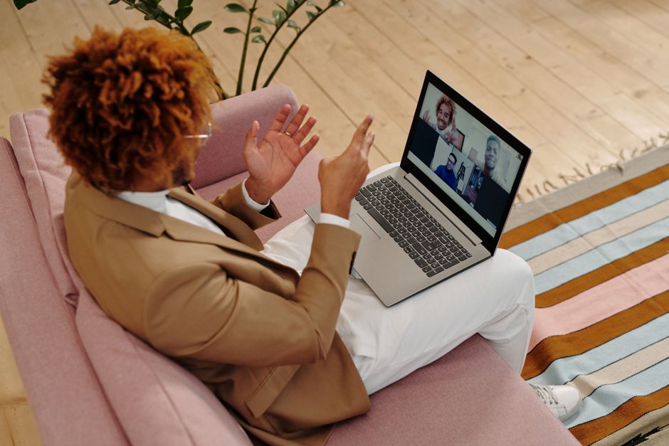 Adult man in suit engaging in video call