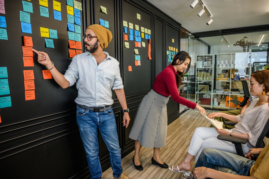 Team collaborating with sticky notes