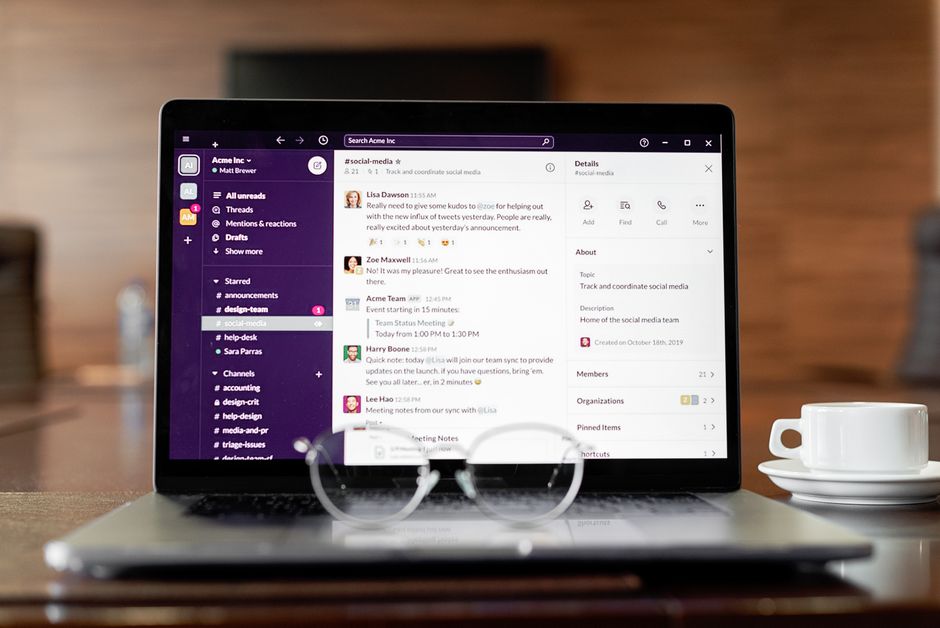 Laptop displaying messaging app with coffee