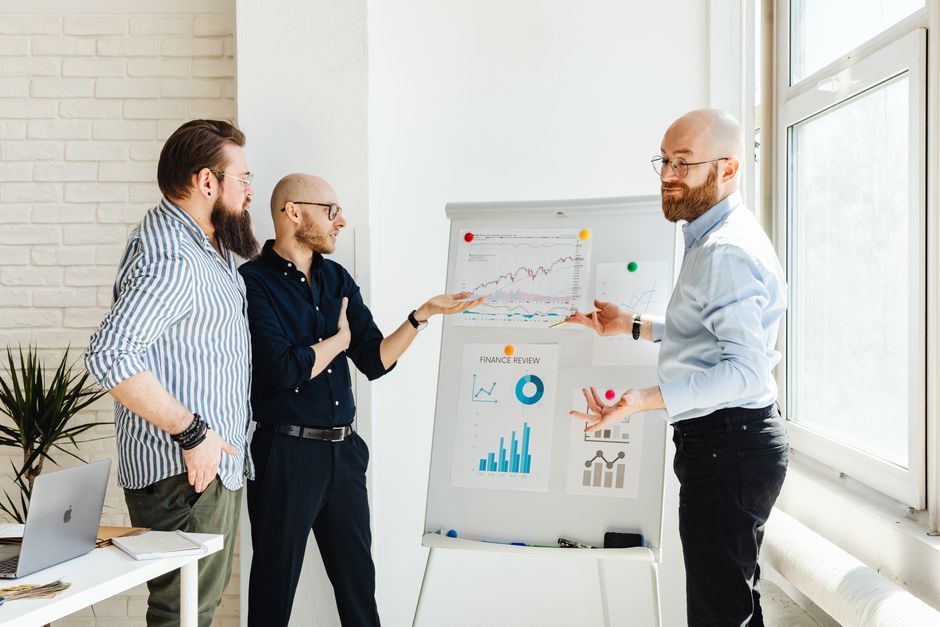 Colleagues discussing charts