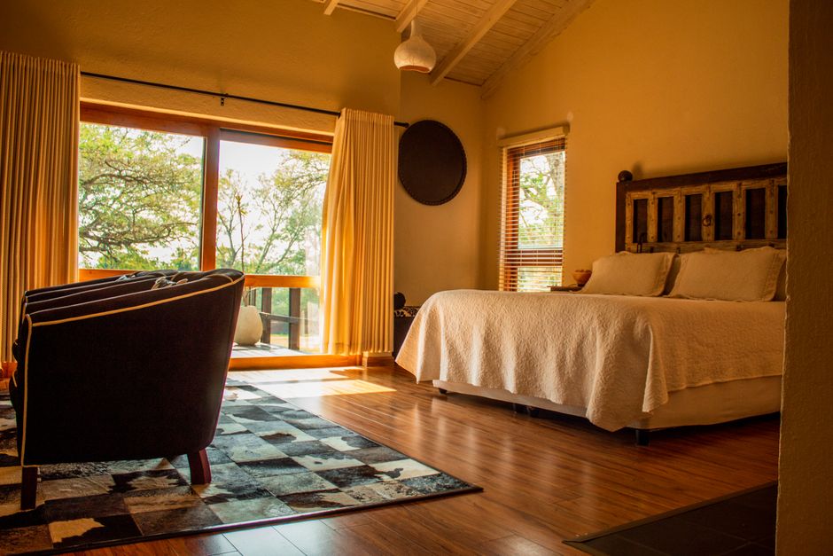 Warm rustic bedroom with a scenic view in South Africa