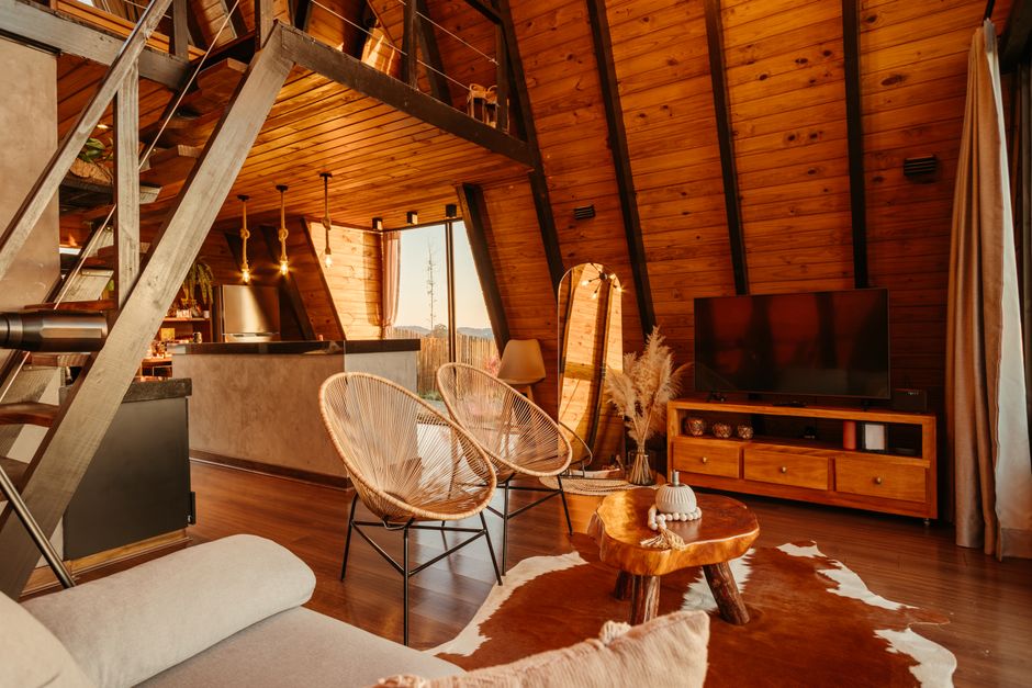 Warm and inviting A-frame cabin interior featuring rustic decor