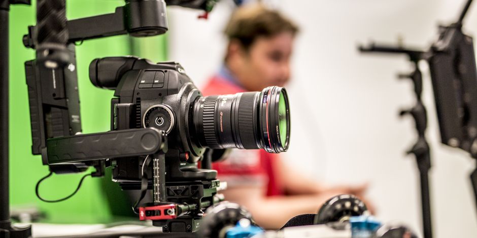 Close-up of a professional DSLR camera being used on a film set