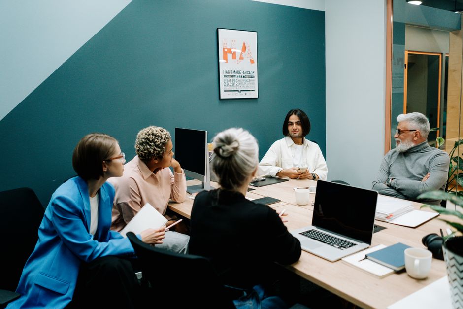 A diverse group of professionals engaged in a dynamic meeting