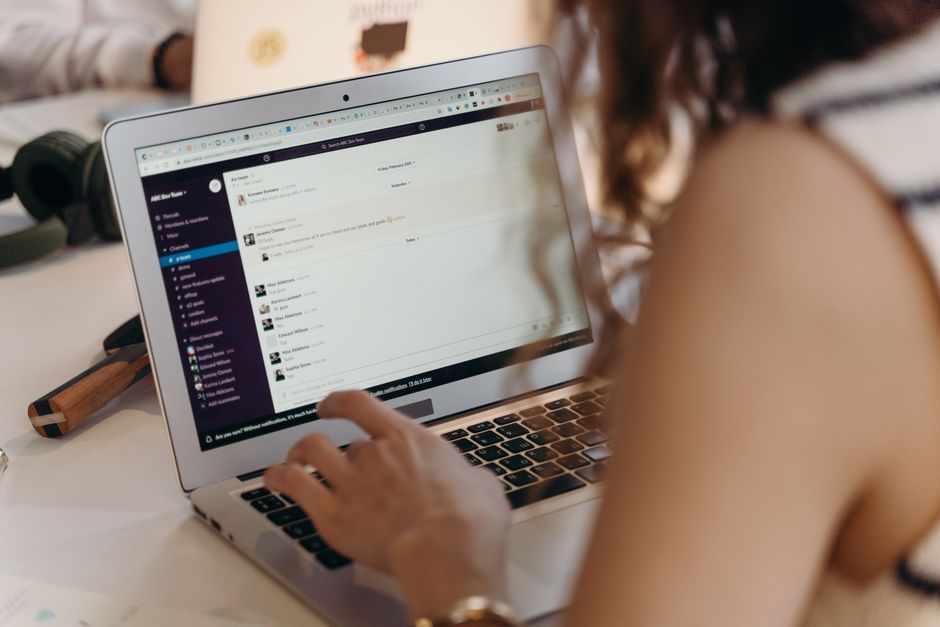 Businesswoman typing on laptop in office