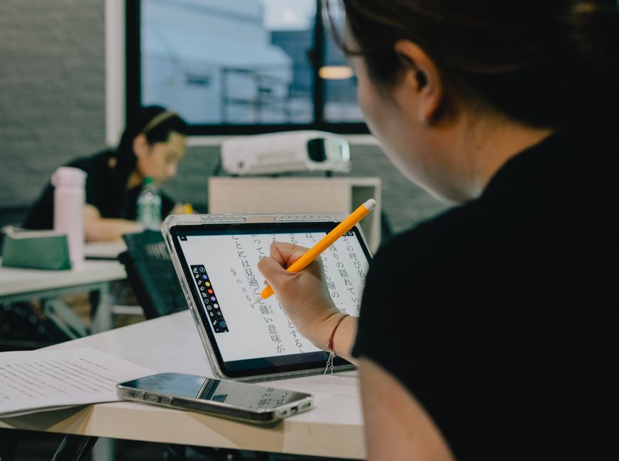 Students in a classroom using tablets