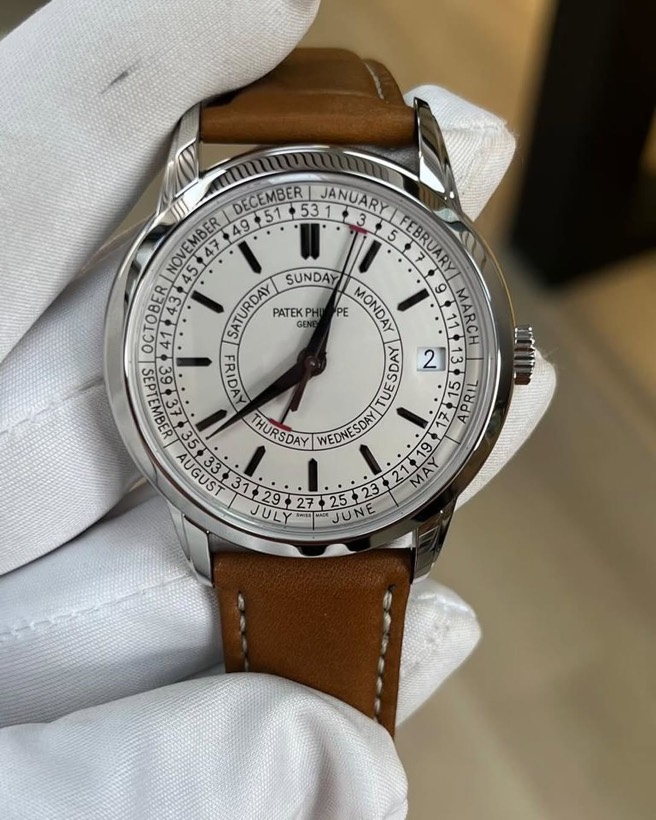 Patek Philippe Weekly Calendar with silver dial on a tan leather strap