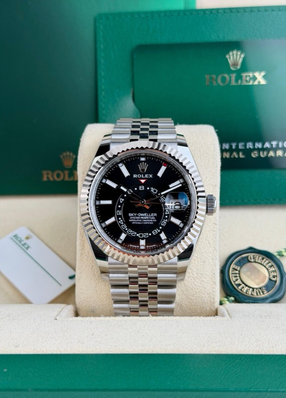 Rolex Sky-Dweller with black dial and fluted white gold bezel on a Jubilee bracelet