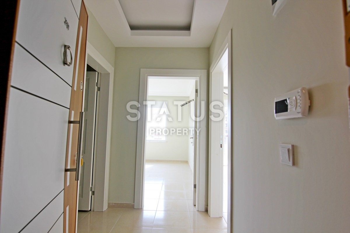 Новая двухкомнатная квартира в центре района Махмутлар , 60м2. фото 19