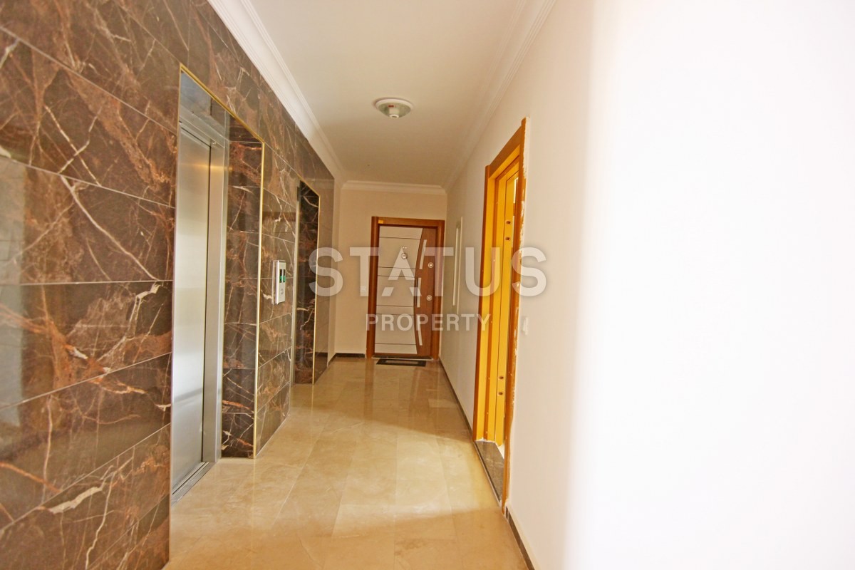 Новая двухкомнатная квартира в центре района Махмутлар , 60м2. фото 20