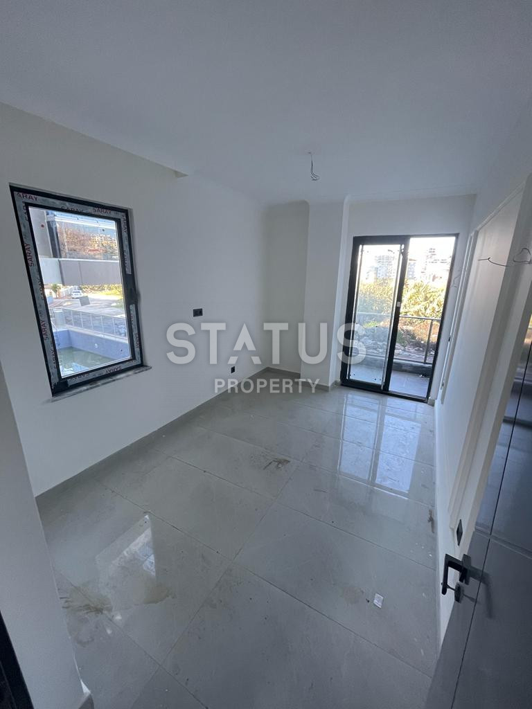 Новая квартира 1+1 в районе Махмутлар, 55 м2 фото 15